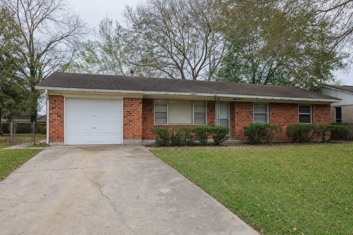 Street view of 111 Princess Dr, a single-story brick ranch house in Houston